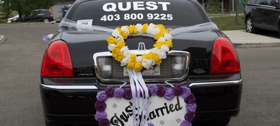 Limousine of Quest Limos decorated for wedding in Calgary AB